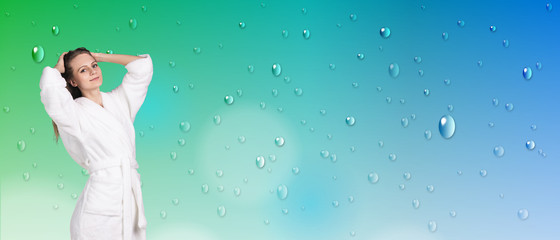 Young woman in white bathrobe