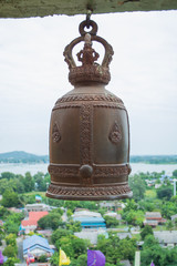 A bell in Thai temple with township and river background