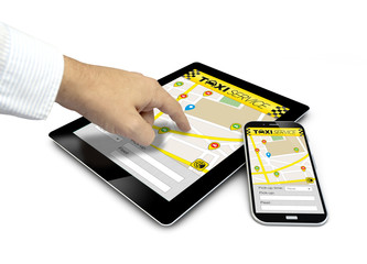 group of touchscreen devices with taxi app and a finger touching