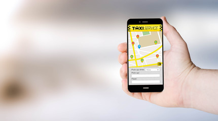 mobile app taxi on user´s hand