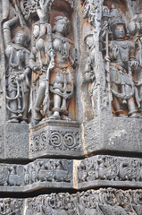 Ancient hindu temple with intricate carvings in the walls of Halebidu temple, Karnataka, India
