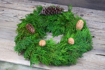 Christmas wreath with pinecones and walnuts