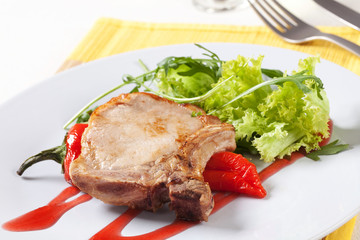 Roast pork chop and accompaniment