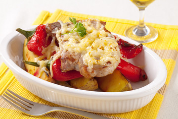 Pork chop with potatoes and red pepper