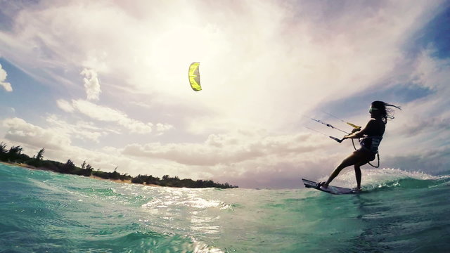 Summer Action Sports. Young Woman Kitesurfing. Fun in the Ocean. Healthy Active Lifestyle. 