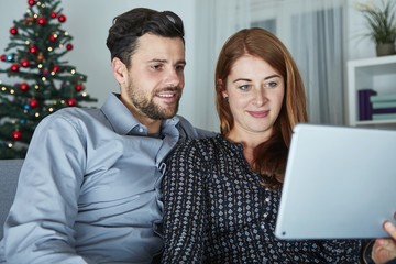 couple use or watch something on tablet pc
