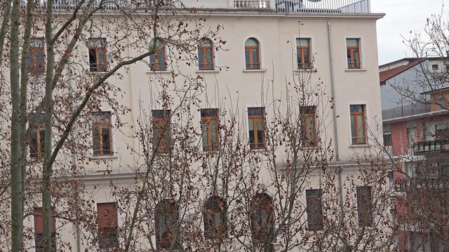 Zoom to appartment window. Establishment shot of 