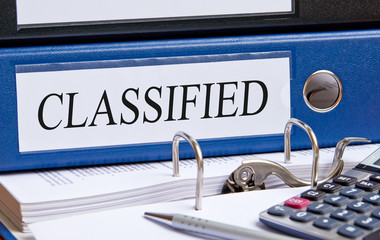 Classified - blue binder in the office