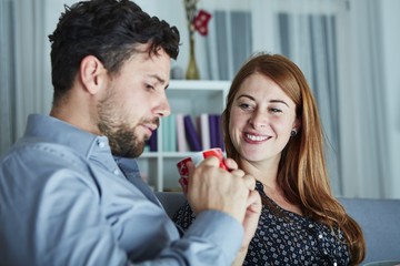 couple enjoying hot tee or coffee