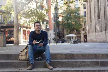 Young man taking photos in Barcelona
