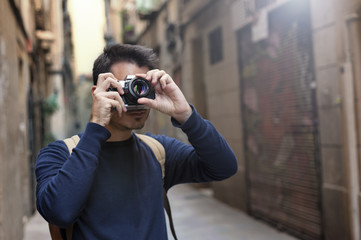 Young man taking photos in Barcelona