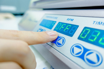  finger, pressing the button of the modern device.