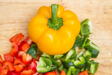 sweet peppers on wooden background