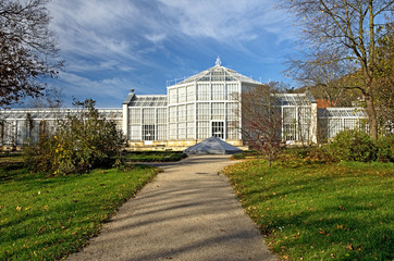 Fototapeta na wymiar Greenhouse ecosystem. Botanical garden with tropical plants in a autumn park.