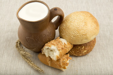 clay jug with milk and bread