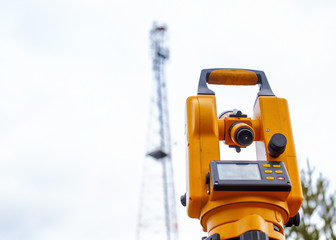 monitoring of telecommunication tower with a theodolite. surveying cell phone towers in the...