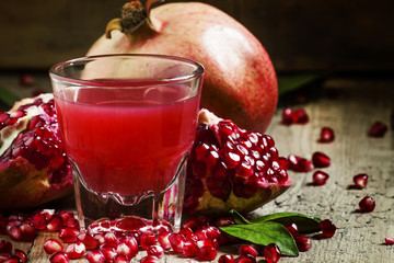 Freshly squeezed pomegranate juice, selective focus