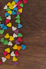 Obraz na płótnie Canvas sweet color candies on heart-shaped cakes