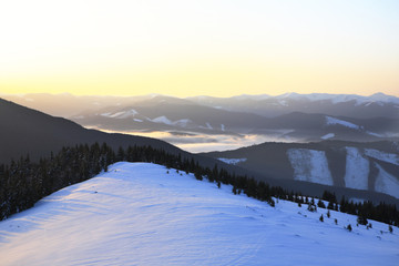 Fototapeta na wymiar The slopes of the Carpathian Mountains, covered with snow.