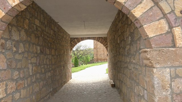 Walk POV through the tunnel to old 