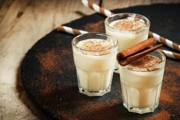 Tuinposter Traditional winter eggnog  with milk, rum and cinnamon, sprinkle © 5ph