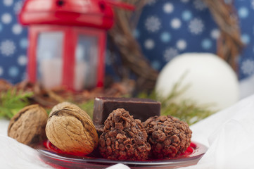 chocolates and walnut on the background of Christmas composition