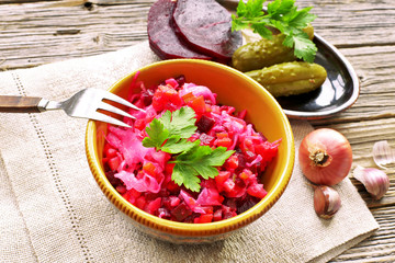 Beetroot salad in ceramic bowl with parsley 