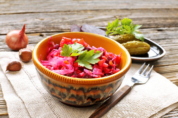 Beetroot salad in ceramic bowl with parsley 