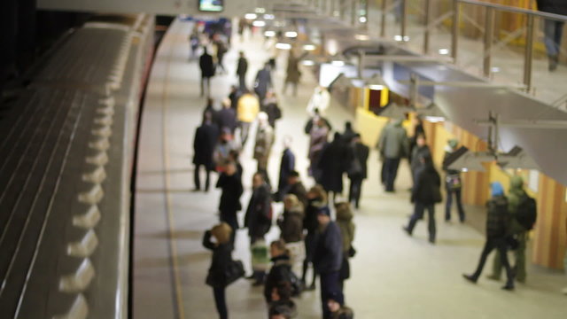 Train pulls in at train station - defocused