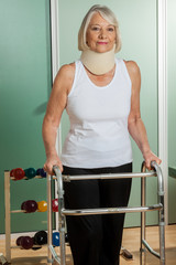 Woman with a orthopedic neck using the walker