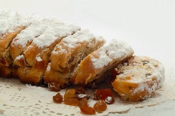 Fresh Christmas Stolle Dresden with raisins closeup on a beautif