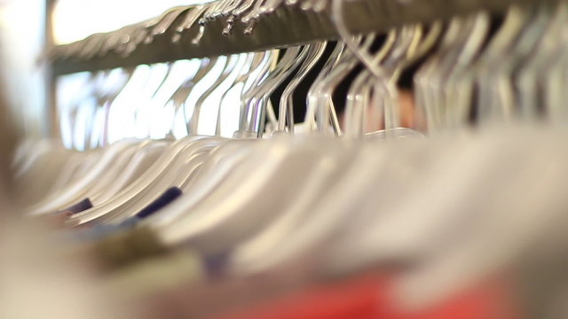 Multitude of clothes hangers in store