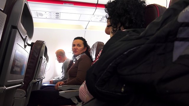 Smiling. Happy. friends travelling by plane together 
