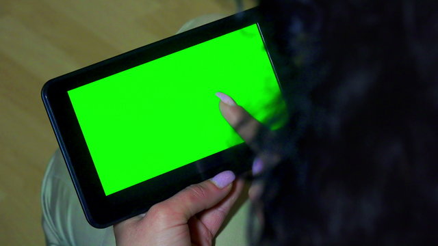 Business woman holds a blank tablet PC 