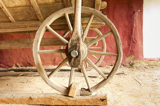 old wooden wagon wheel in an old barn