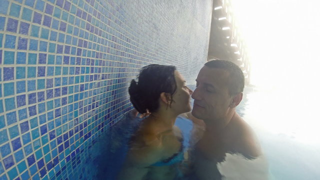 Romantic couple chante touches and kisses in 