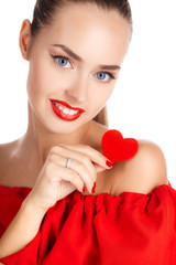 Portrait of beautiful girl with red heart