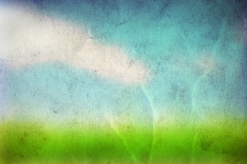 Conceptual green grass and sky old paper