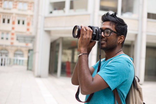 young man taking a photo