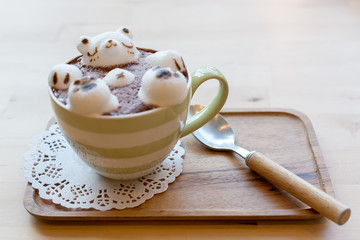 Polar bear floating in hot cappuccino