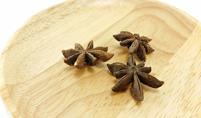 star anise on wooden plate