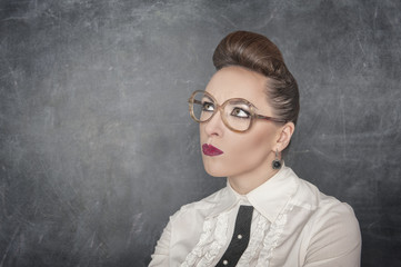 Woman in eyeglasses looking on something