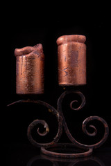 bronze candlestick with candles on a black background