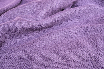 Closeup wrinkled purple jacket fabric background