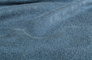 Naklejka premium Closeup wrinkled blue jacket fabric background
