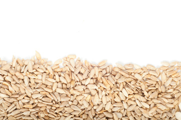 Shelled sunflower seeds on white background