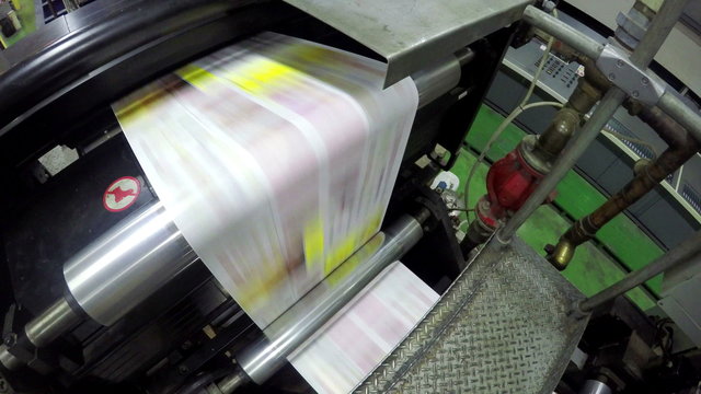 Close-up of printing mechanism rolling freshly typed 
