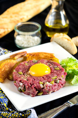 Raw beef steak tartare with French fries