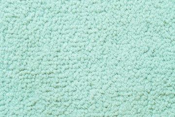 Fototapeta na wymiar Closeup green carpet in the temple texture background