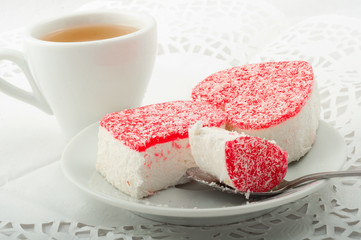  Two heart-shaped Cake with cup of green tea